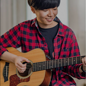 student playing the guitar