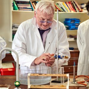 a teacher demonstrating a practical