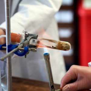 a test tube being lit by a Bunsen burner