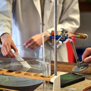 students with a Bunsen burner