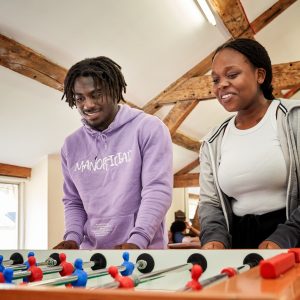 students playing foosball