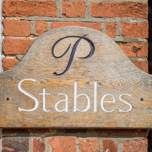 Sign for the Stables