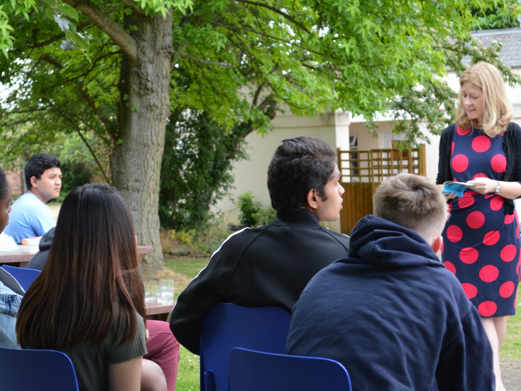 Teacher talking to students