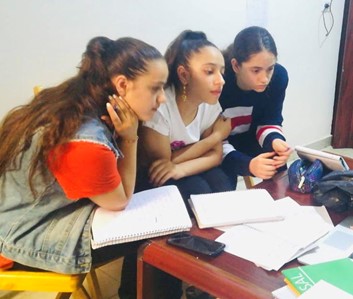 Students working around a table