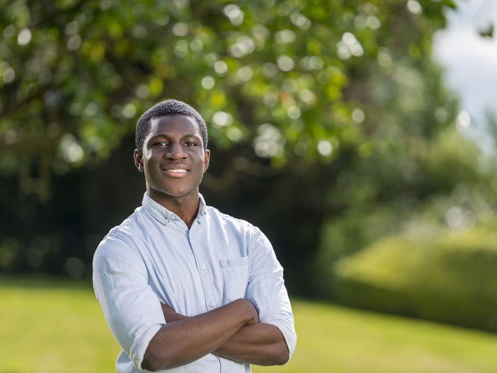 student with his arms crossed