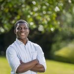 student with his arms crossed