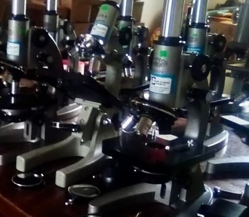 Microscopes being donated to a school in Uganda