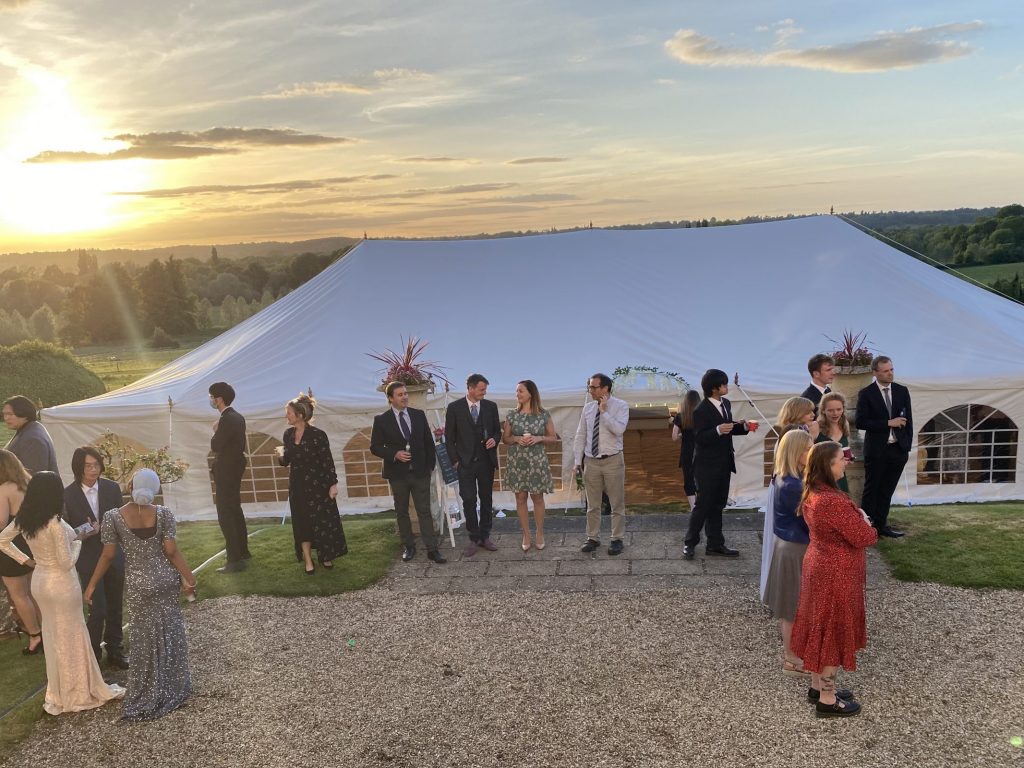 Students in a gazebo tent area