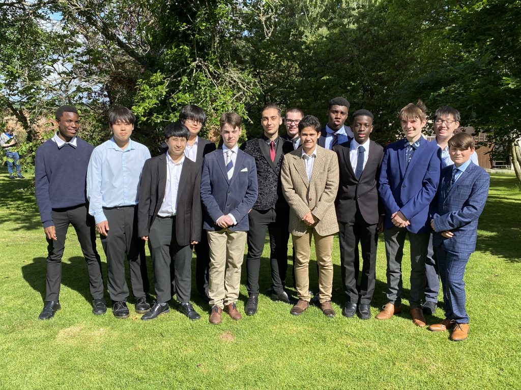 A group of students dressed in suits