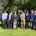 A group of students dressed in suits